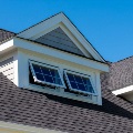 open awning windows on top floor of home