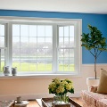 bay window inside home living room overlooking pond