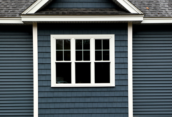 Exterior of home featuring Harvey Windows casing