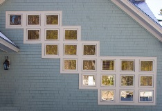 side of house exterior featuring harvey majesty picture windows