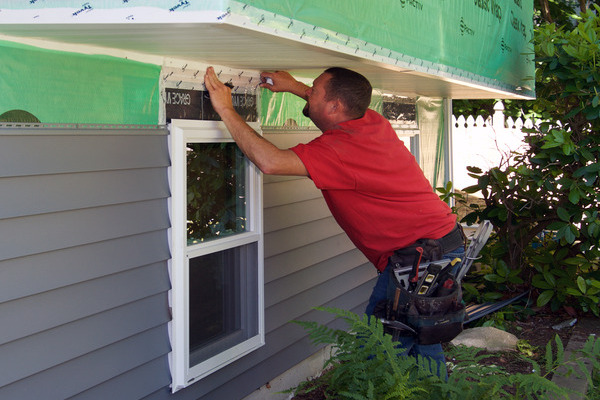 contractor installing harvey windows