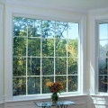 large picture window inside home living room