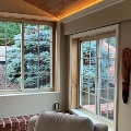 interior of home with rolling windows near fireplace