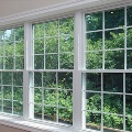 three single hung windows inside home