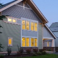 side of home with two rows of single hung windows