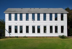 exterior of home with multiple large double hung windows